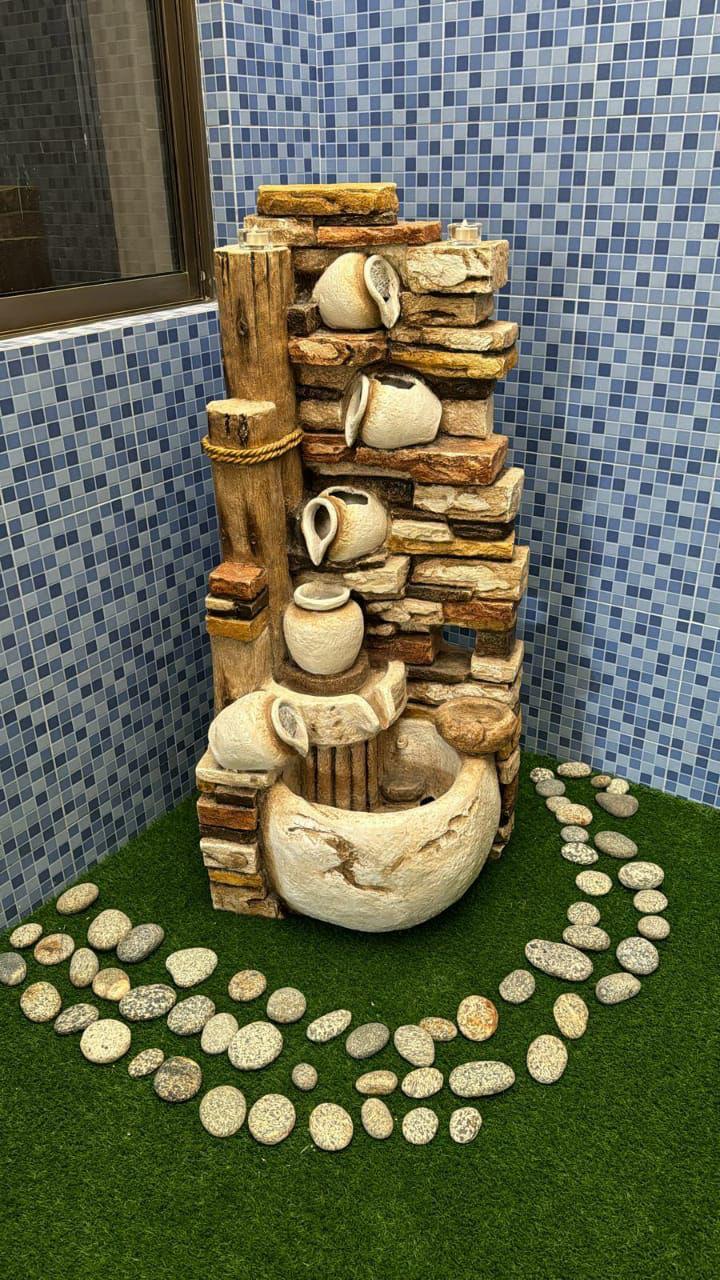 Rustic tiered stone water fountain