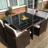 Black Rattan Dining Set with Glass Table and White Cushions