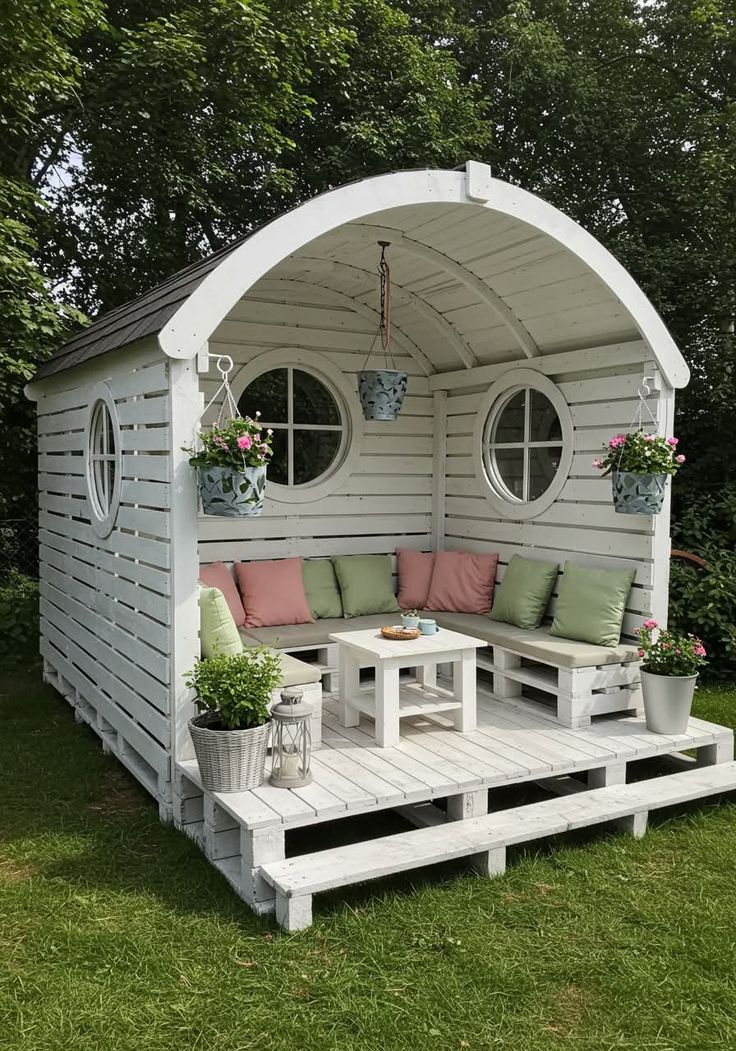 Arched Roof Pallet Cabin with Round Windows