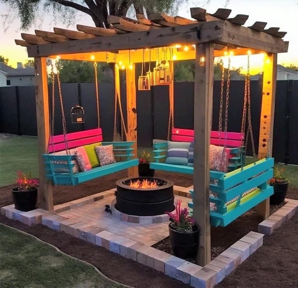 Wooden pergola with four hanging pallet swing benches around a central fire pit