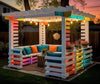 White Pallet Pergola Lounge with Rainbow LED Accents