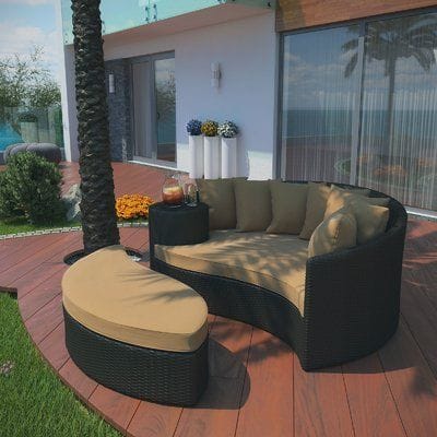 Curved Dark Rattan Sectional with Tan Cushions