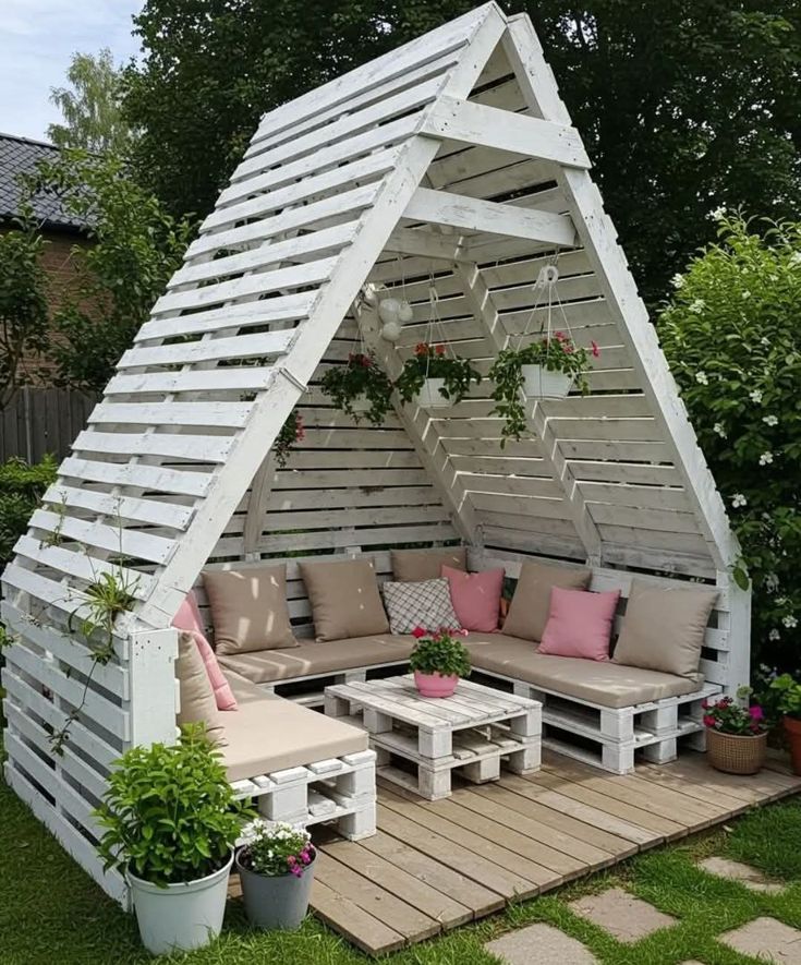 White A-Frame Pallet Shelter with Beige Corner Sofa