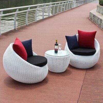White Rattan Pod Chairs with Red and Black Cushions