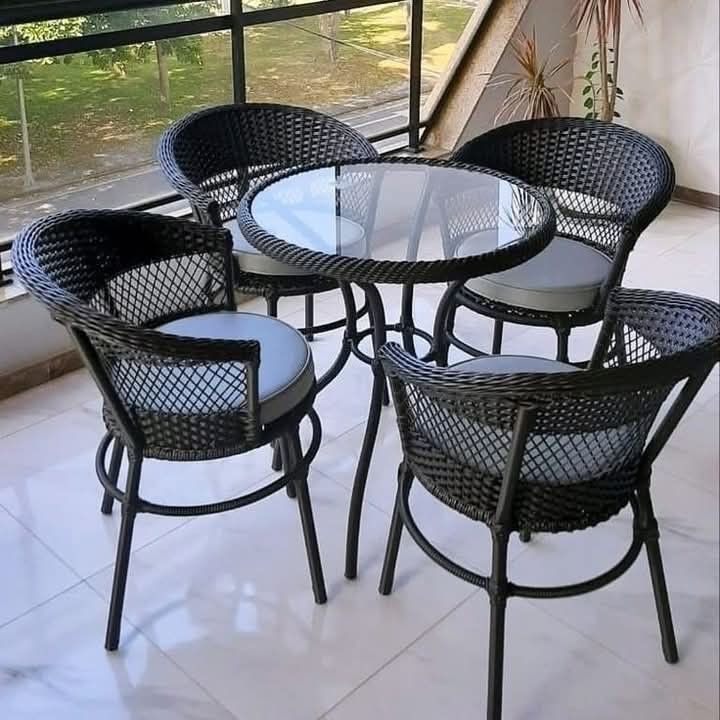 Black Rattan 4-Chair Set with Round Glass Table