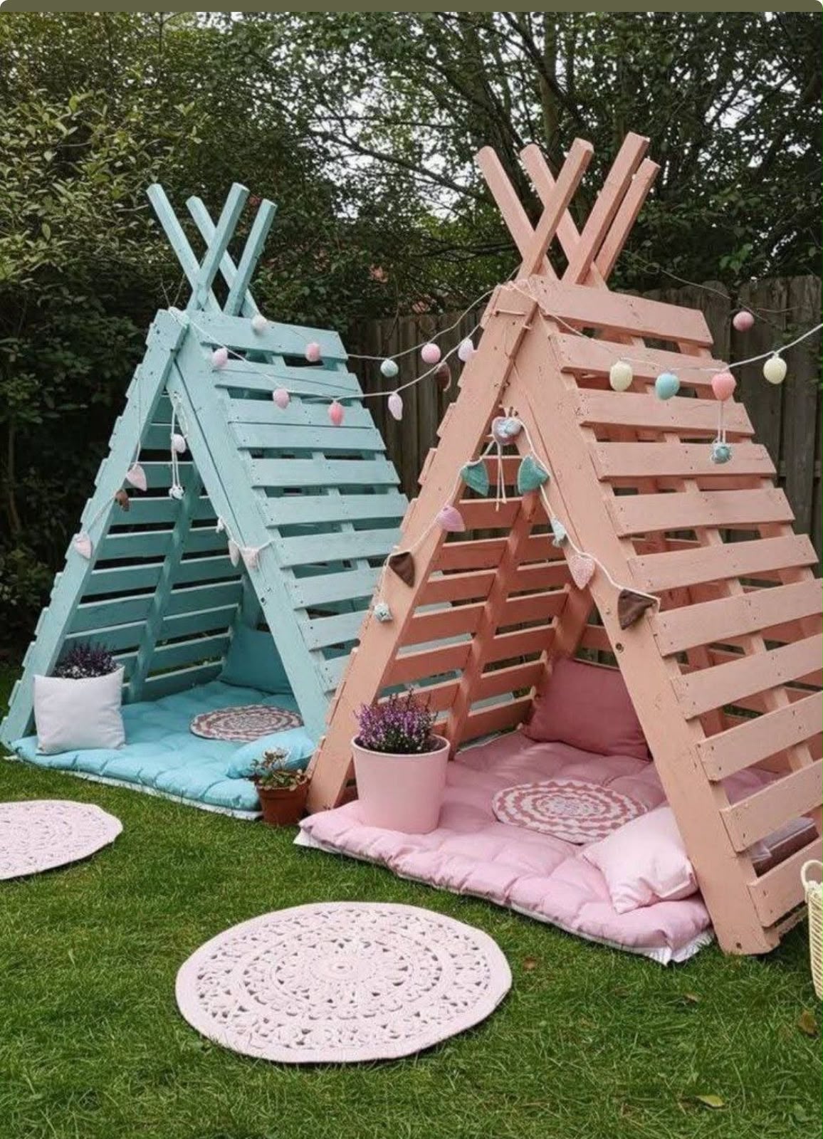 Pastel blue and pink pallet teepee play tents with cushions