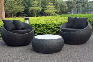 Black Rattan Pod Chairs with Round Glass-Top Table
