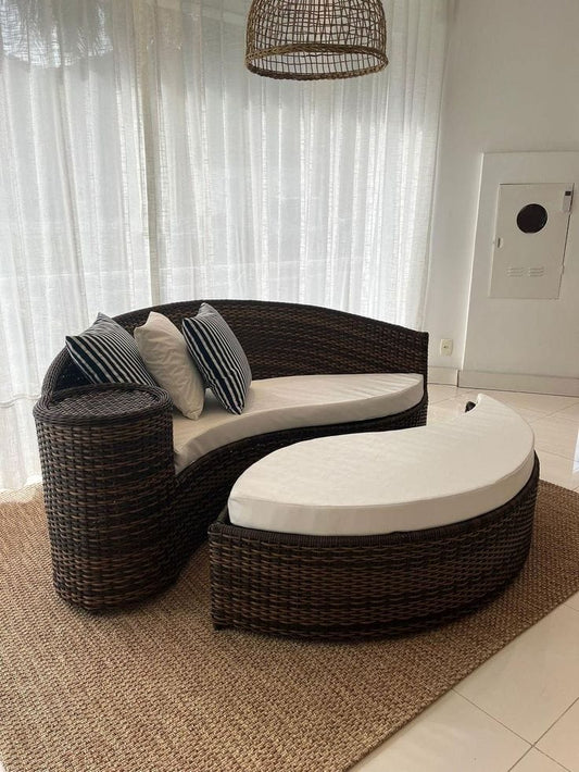 Curved Black Rattan Sofa with Cream Cushions